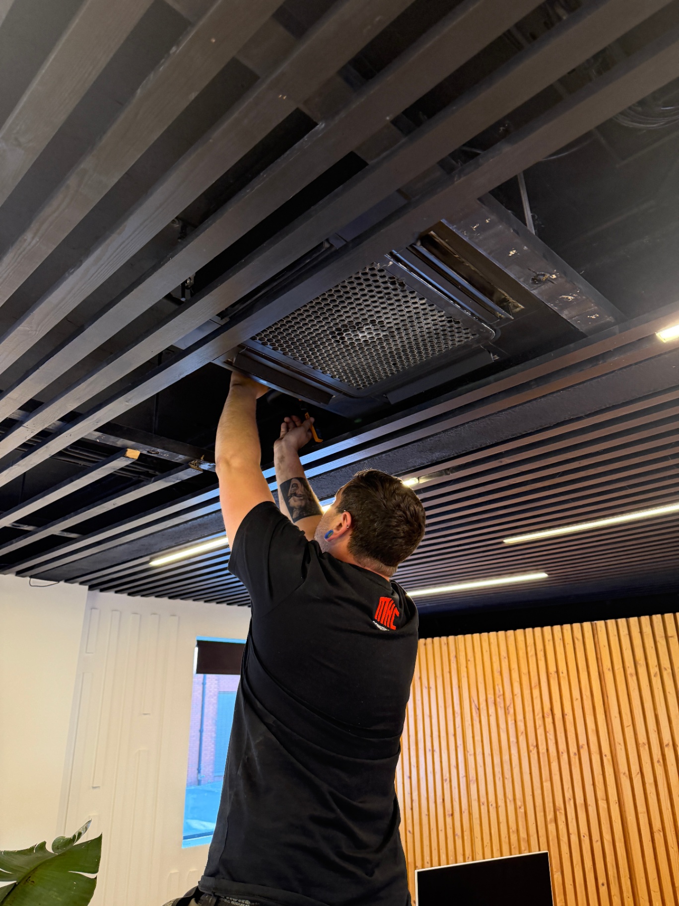 Air conditioning maintenance — replacing grille after filter clean